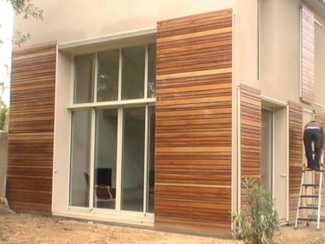 Fabricant de volets coulissants en bois exotique architecte Henri Gueydan